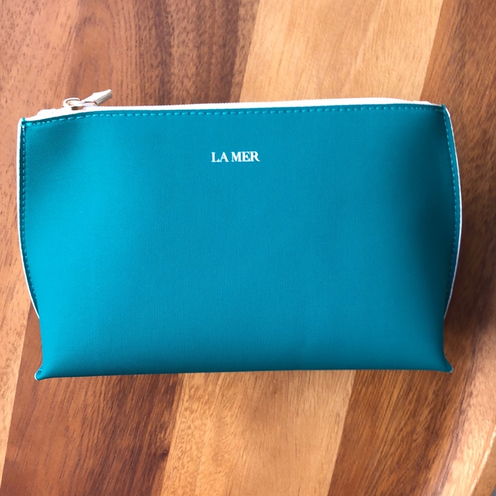Makeup Bag in Teal by La Mer.